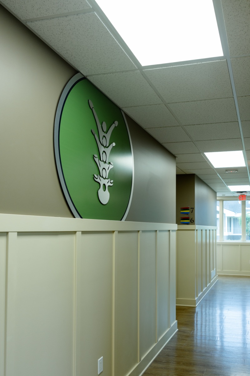 Hallway at Lakeshore Family Chiropractic with the practice emblem